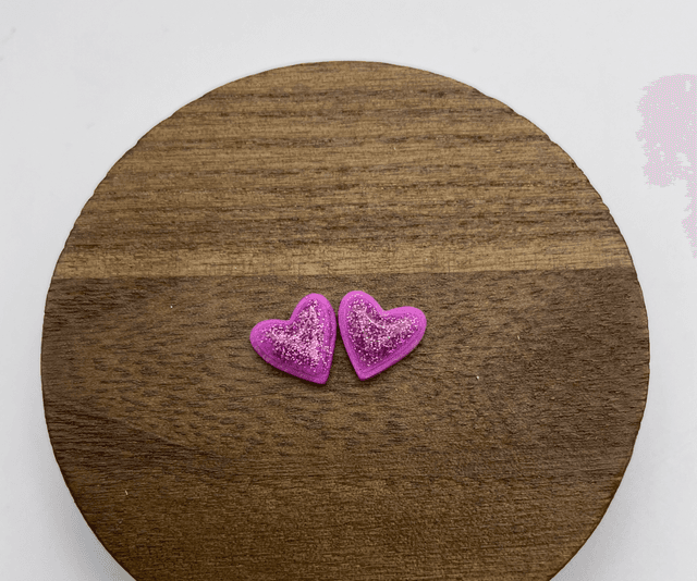Purple glittery heart studs